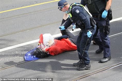 Melbourne protest: Bizarre moment Victoria Police officer claims pepper ...