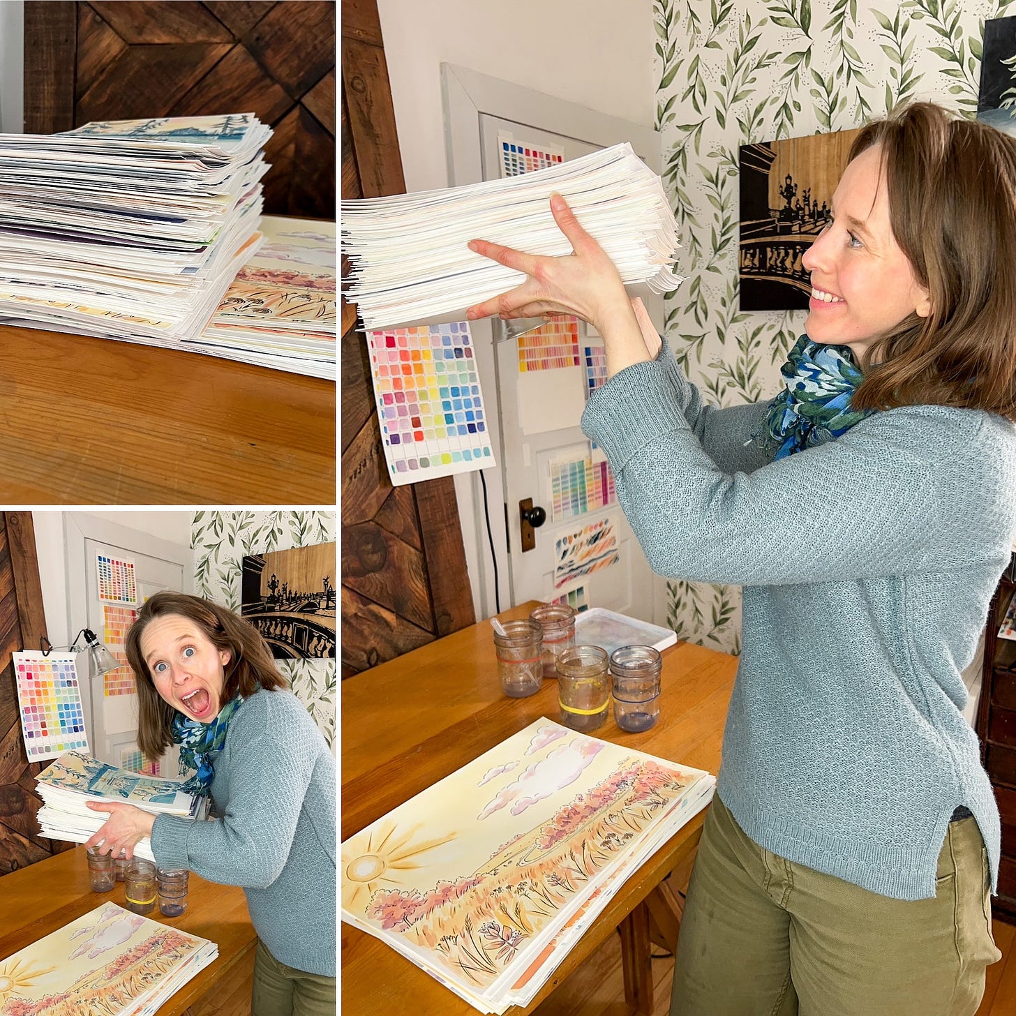 Cartoonist K. Woodman-Maynard holding a stack of watercolor paper of her graphic novel.