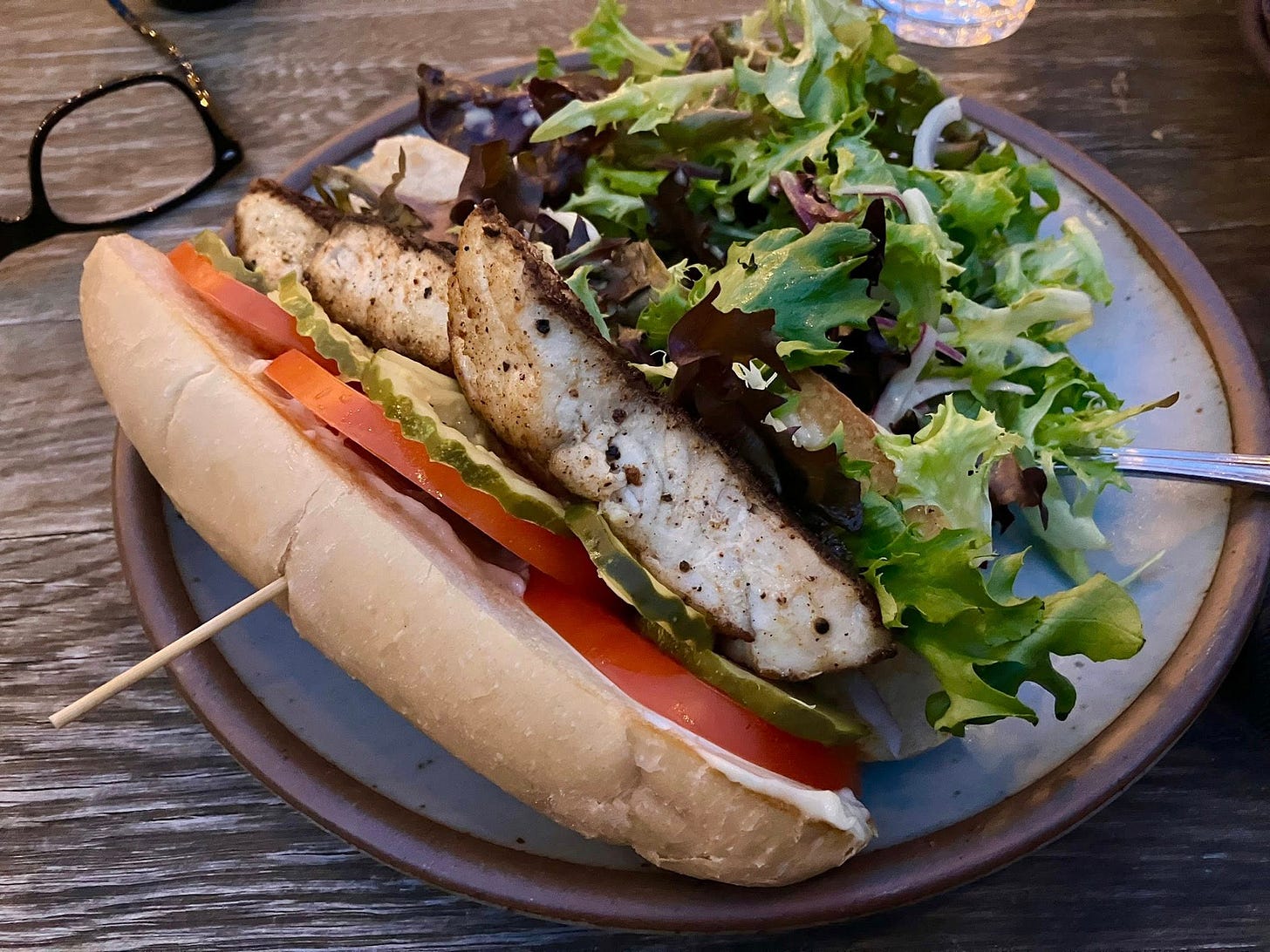 May be an image of chicken sandwich, baguette and club sandwich