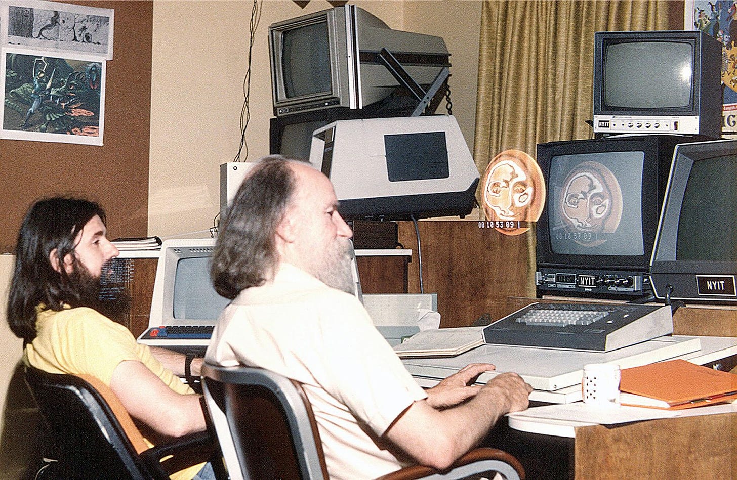 Two men sit at computers in 1979