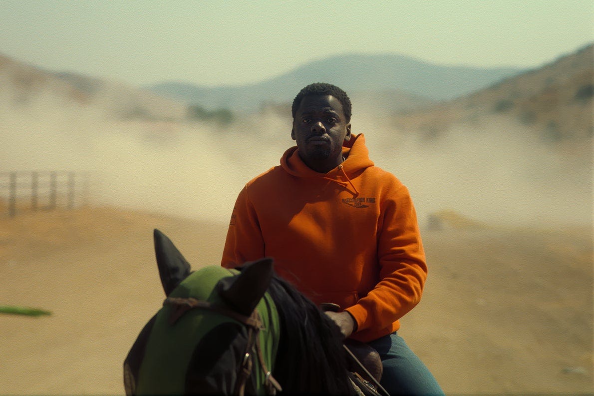 O.J. Haywood, played by Daniel Kaluuya, sits atop a horse