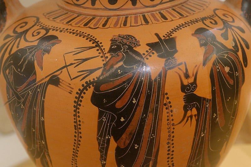 Black figure vase showing Dionysus in the center with Zeus and Poseidon on either side