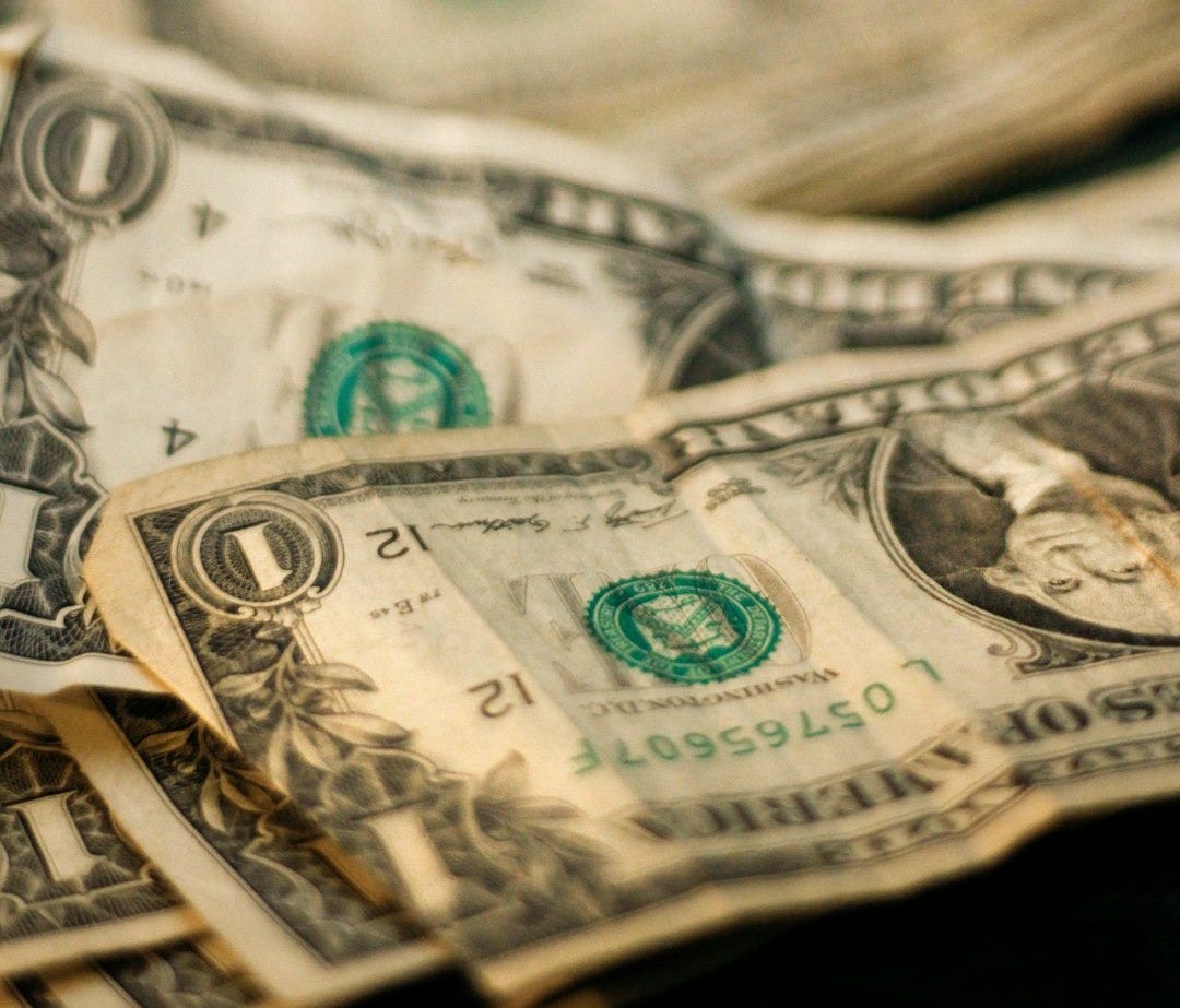 shallow focus photography of U.S. dollar banknotes