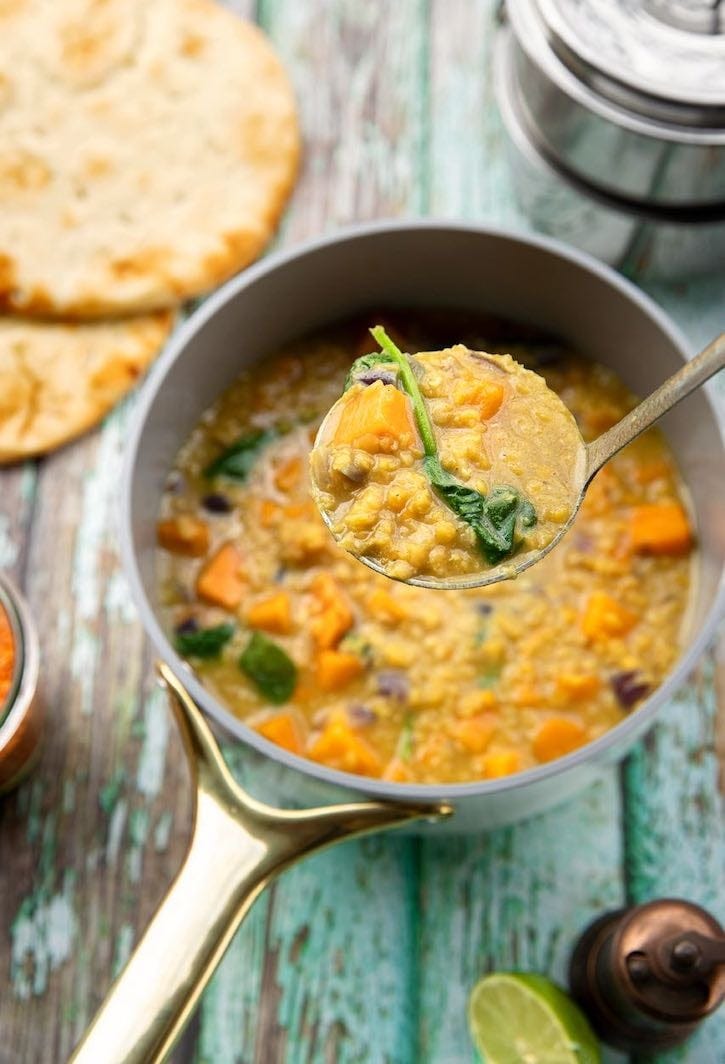 Red lentil soup with sweet potatoes and greens