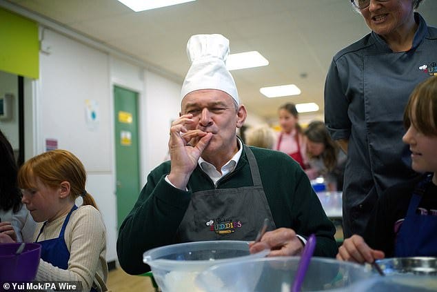 Bread Davey! Lib Dem leader Sir Ed dons a chef's hat during school baking  lesson in latest fun election campaign gimmick after slip 'n slide,  clowning around on a bike and throwing