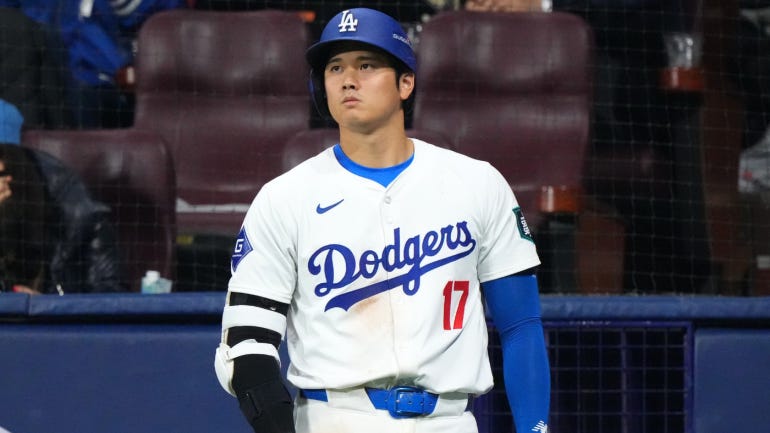 Shohei Ohtani, looking contemplative in a Dodgers uniform.