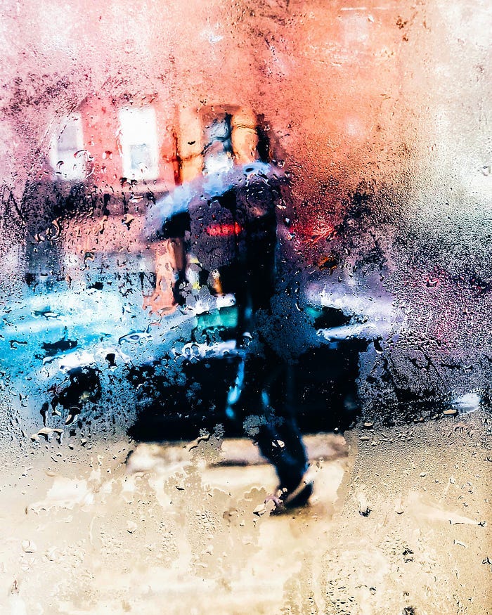 Man walking in the rain