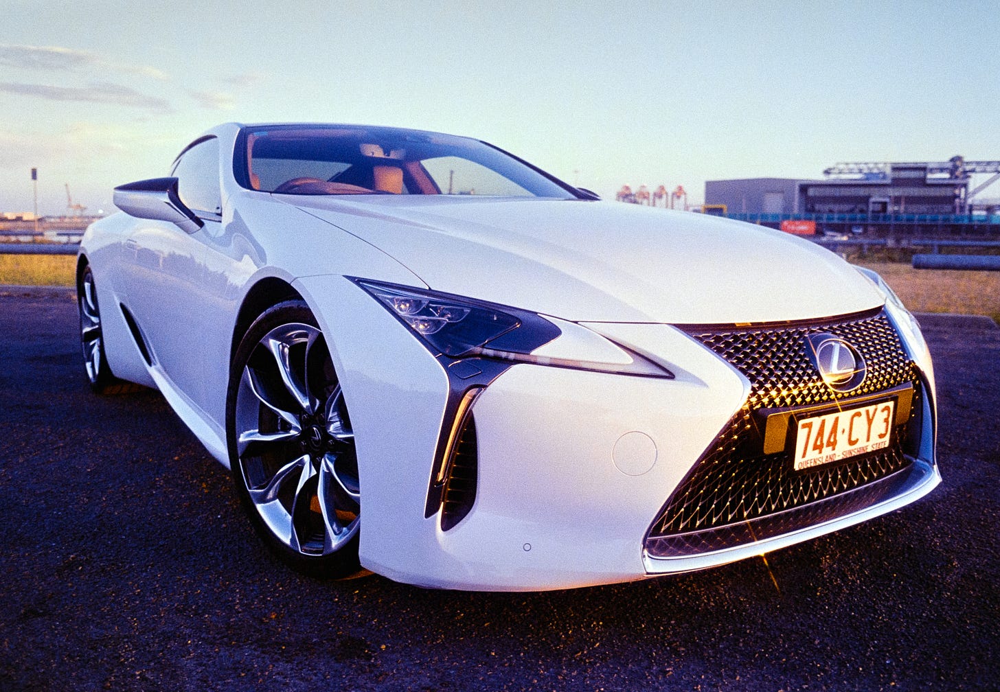 Clem's Lexus LC500 shot with a wide angle lens with the golden sunset reflecting off the car