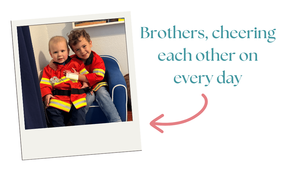 two brothers wearing fireman costumes smiling two brothers wearing fireman costumes smiling
