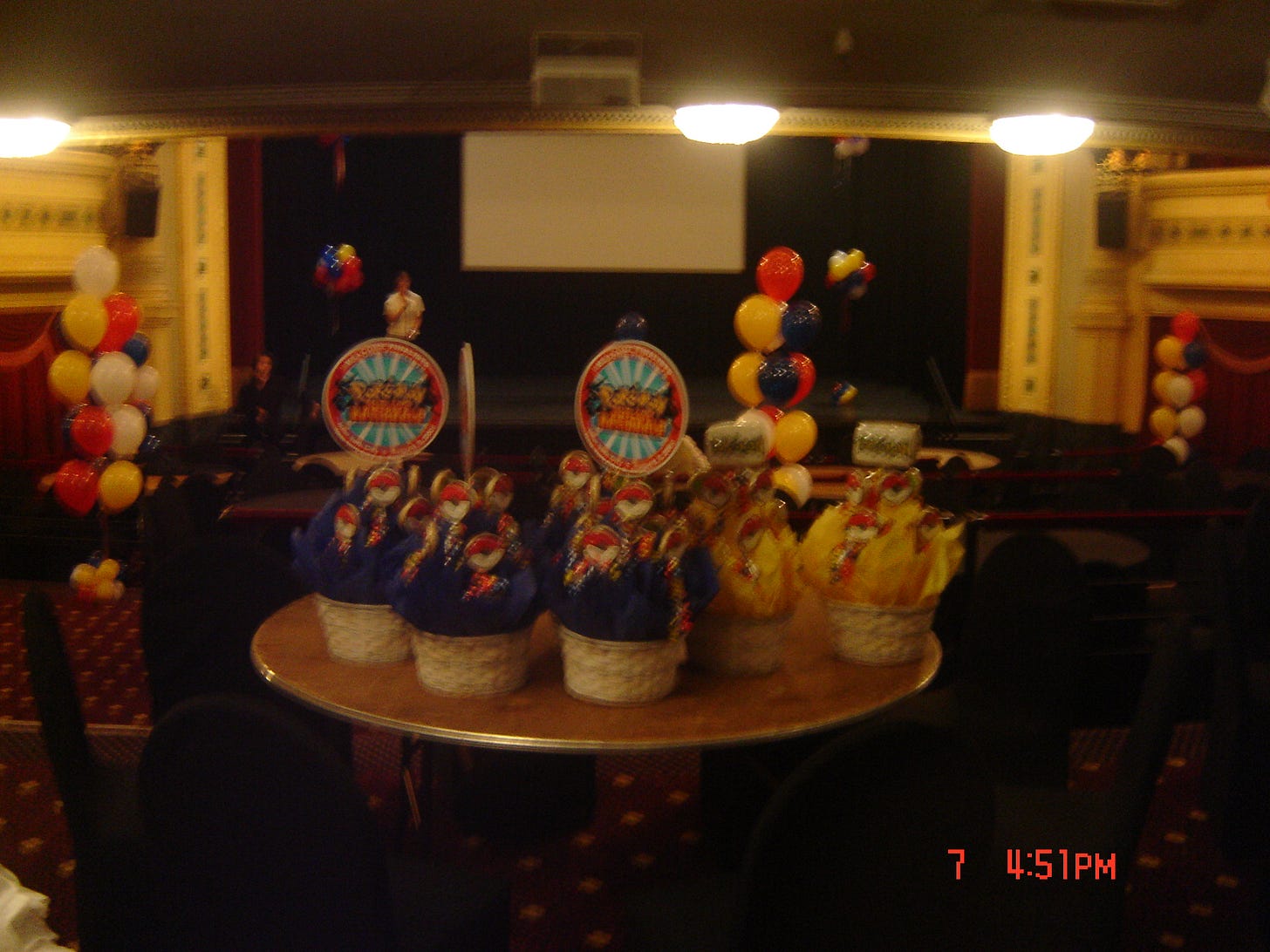 A photograph from the Millennium Hotel, where Peter was staying during the event. According to Peter, the baskets on the table featured the Pokémon Nationals logo, and contained decorative cookies inside of them A photograph from the Millennium Hotel, where Peter was staying during the event. According to Peter, the baskets on the table featured the Pokémon Nationals logo, and contained decorative cookies inside of them