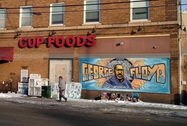 A scene outside of Cup Foods with the George Floyd mural