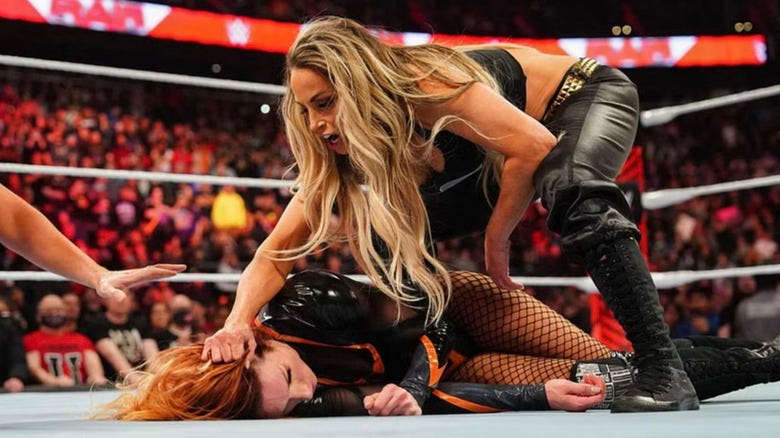 Trish Stratus attacking Becky Lynch