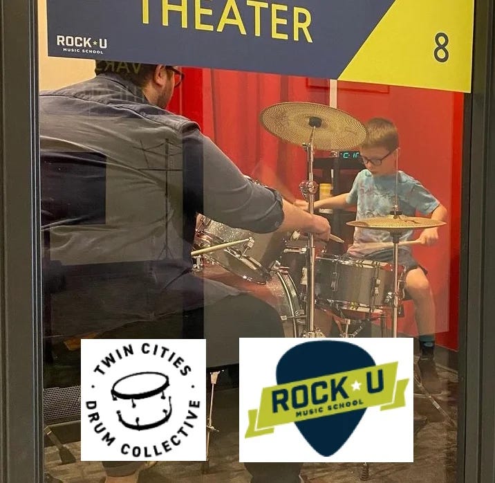 Andy teaching drum lessons in a studio