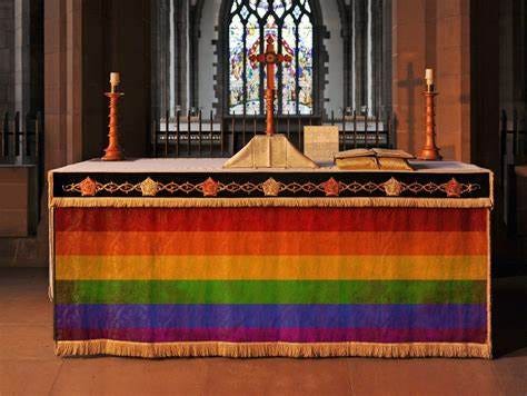 Group Hangs Rainbow LGBT Flag at Catholic Altar