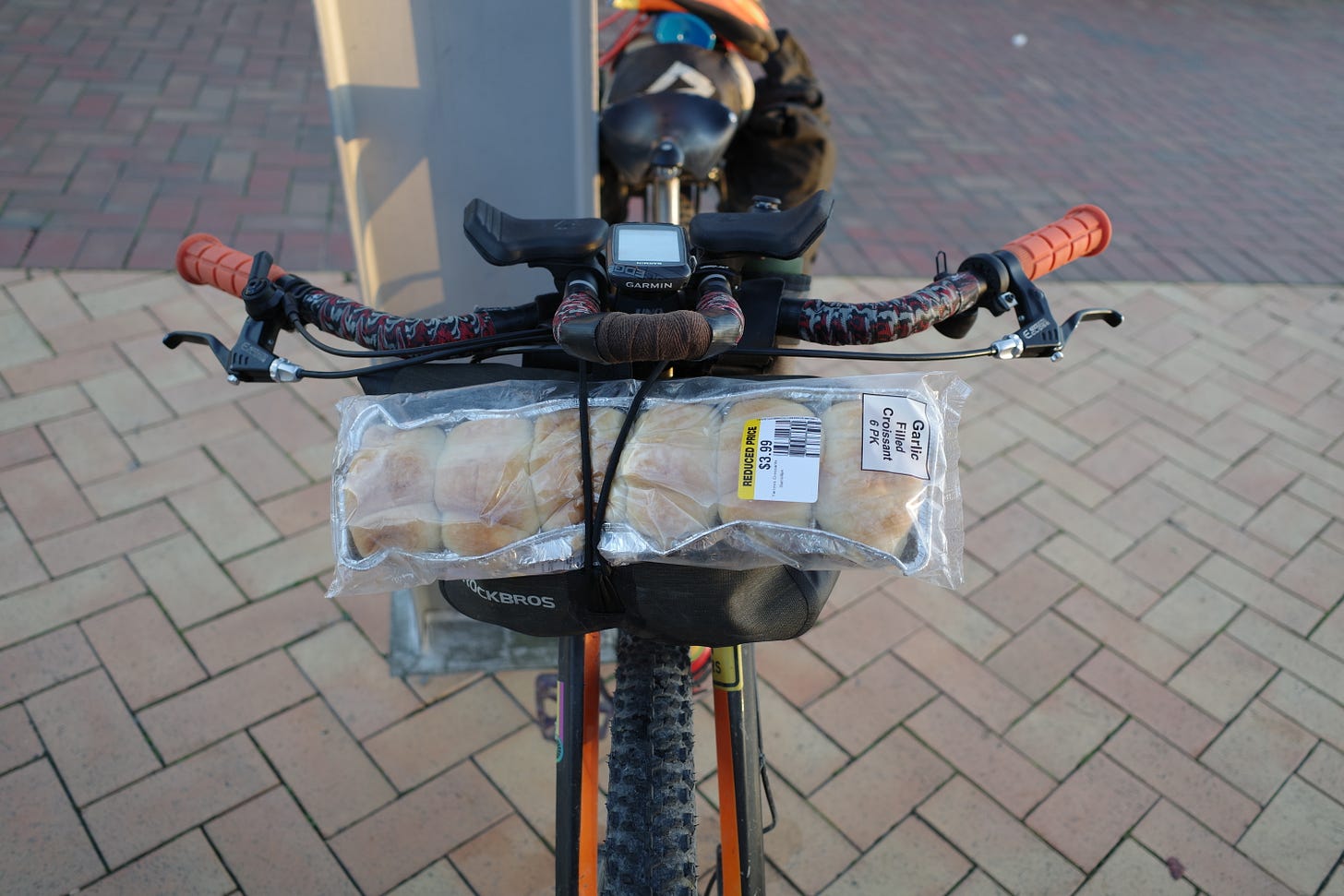 Robbie's bike with 6 garlic filled croissants strapped to the front