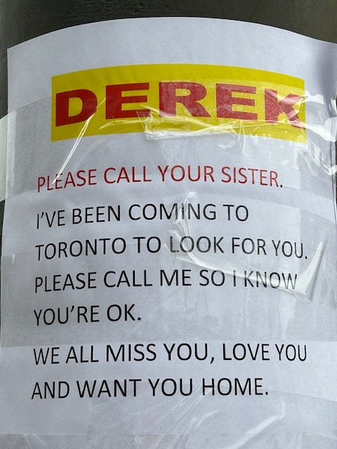 A poster on a lamppost begs Derek to call his sister so she'll know he's okay.