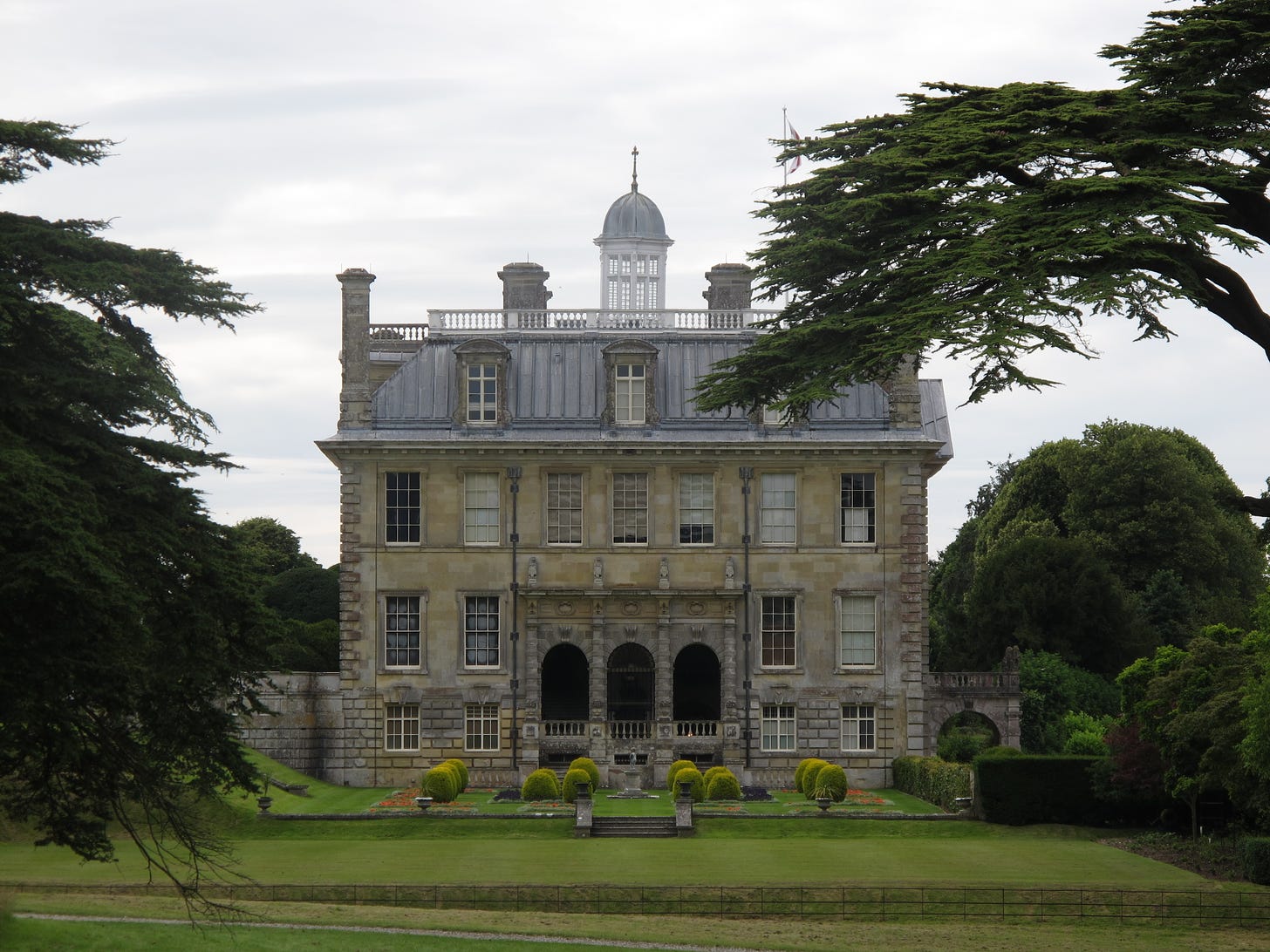 The facade of Kingston Lacy, an English country house, and its gardens.