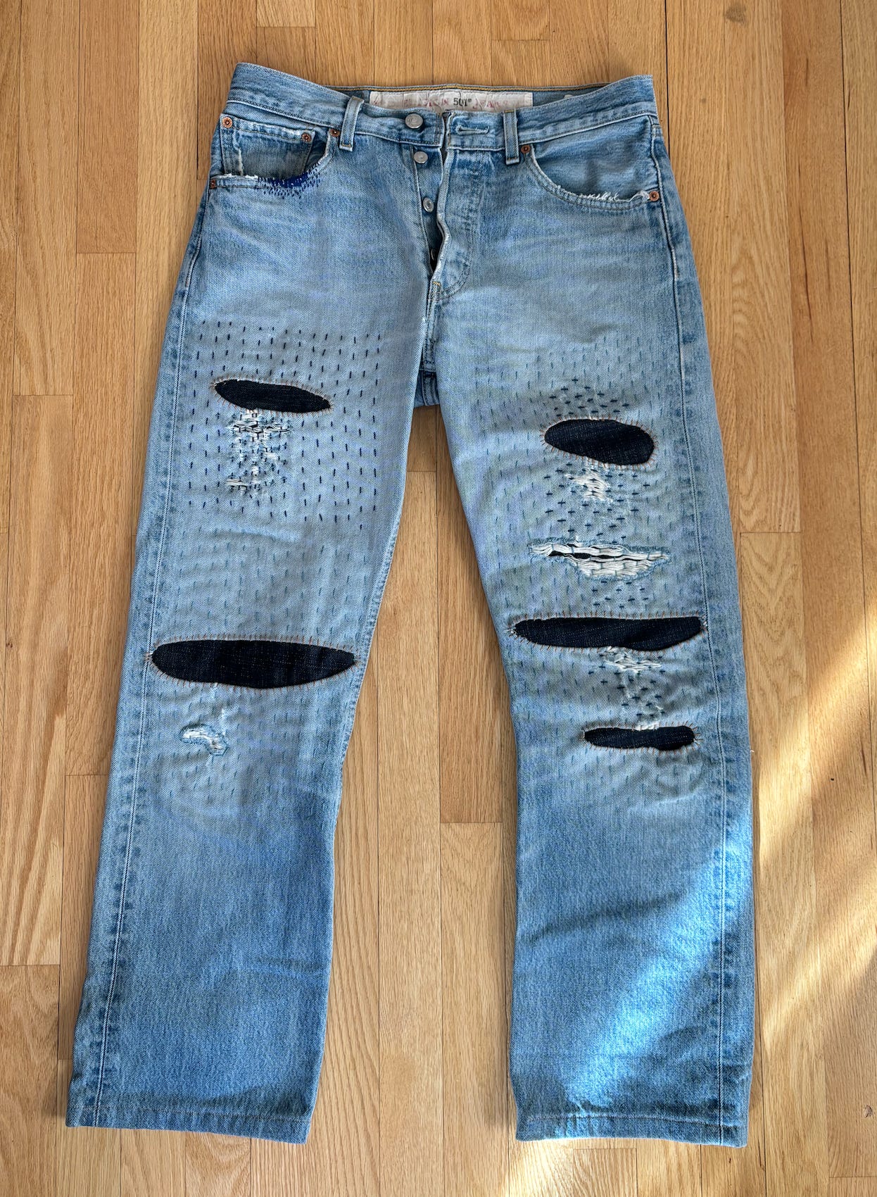 The finished mended levi's