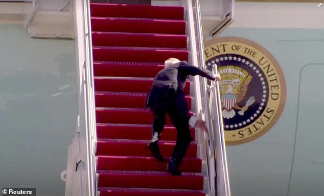 Joe Biden falls up the stairs boarding Air Force One at Joint base Andrews, Maryland