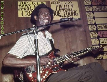 H O U N D   D O G   T A Y L O R at Ruby Gulch in Champaign, IL, 1975, playing his Kawai (Kingston) SD-40 guitar; photographer: André Hobus