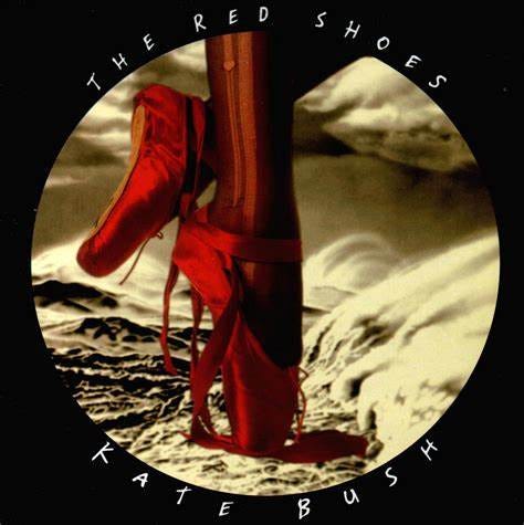 cover dell'album The red Shoes: dei piedi in punta che indossano le scarpette rosse e un paio di calze slabbrate. sullo sfondo un paesaggio roccioso o desertico