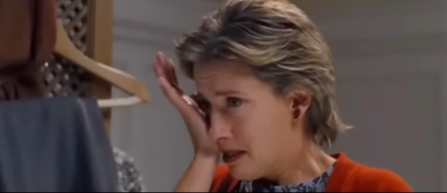 Emma Thompson in love actually, wiping away a tear after realizing her husband is cheating on her and is also not that great at choosing gifts.