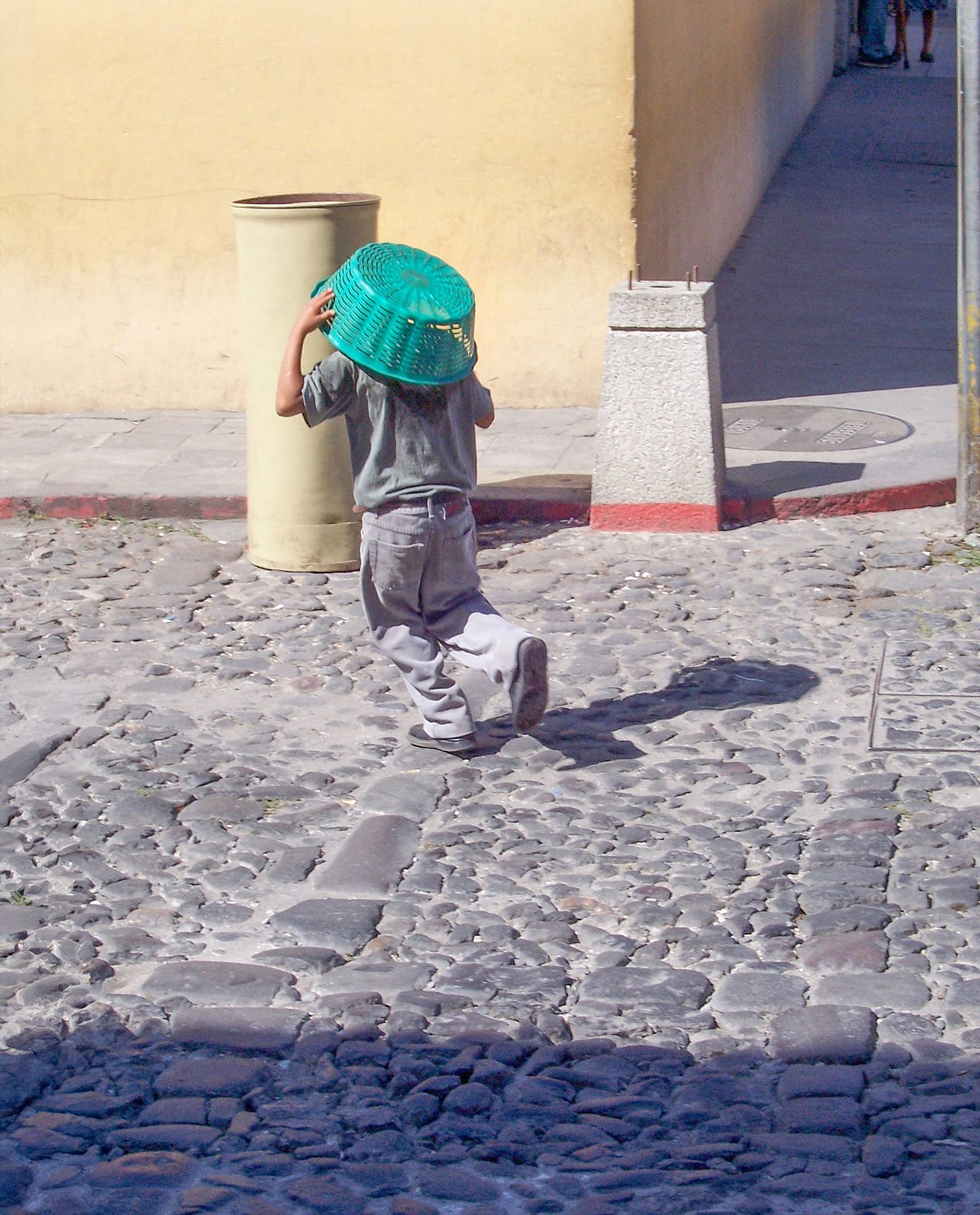Boy with basket over head. Boy with basket over head.