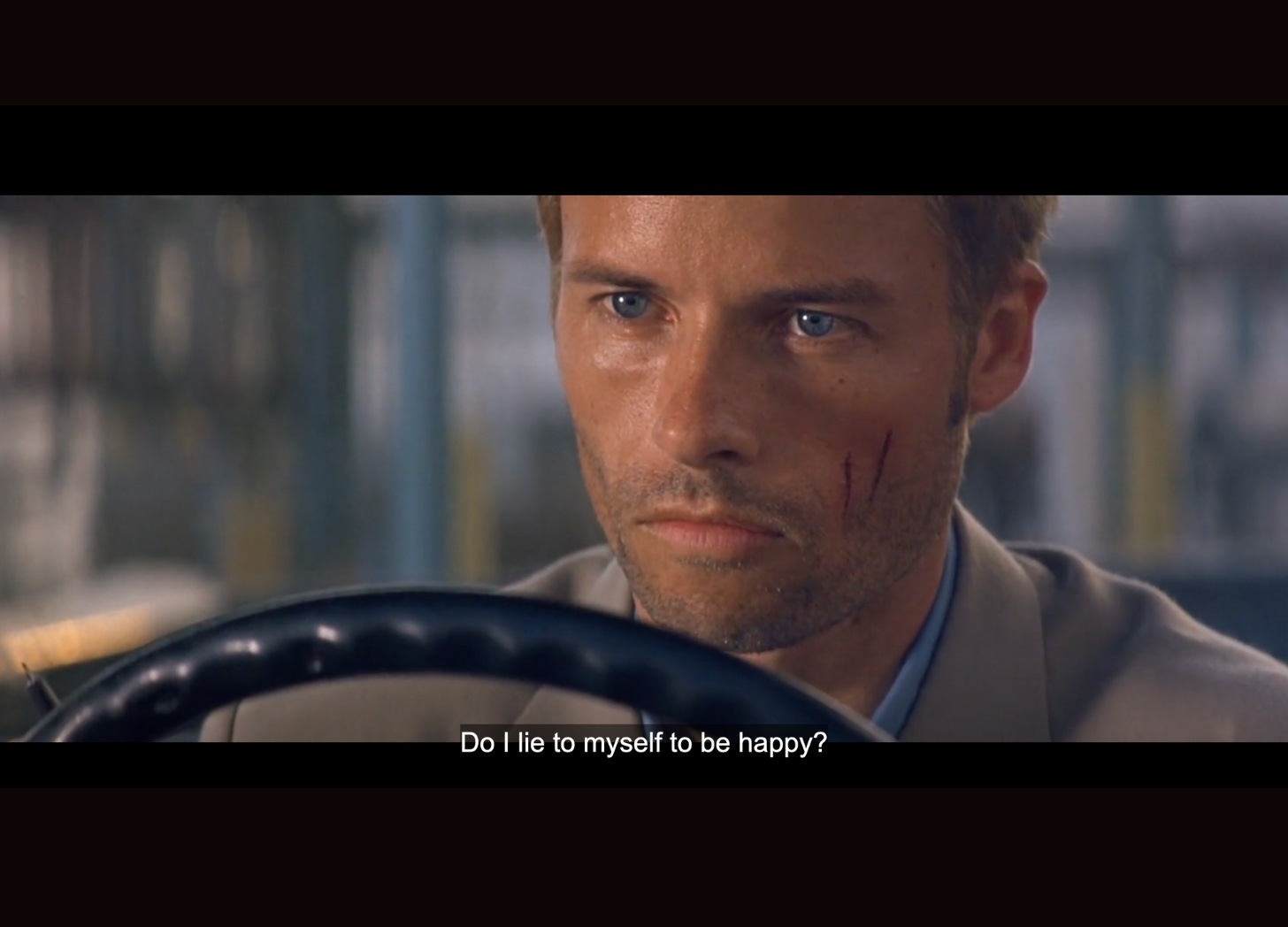 Memento scene with Leonard asking: "Do I lie to myself to be happy?"