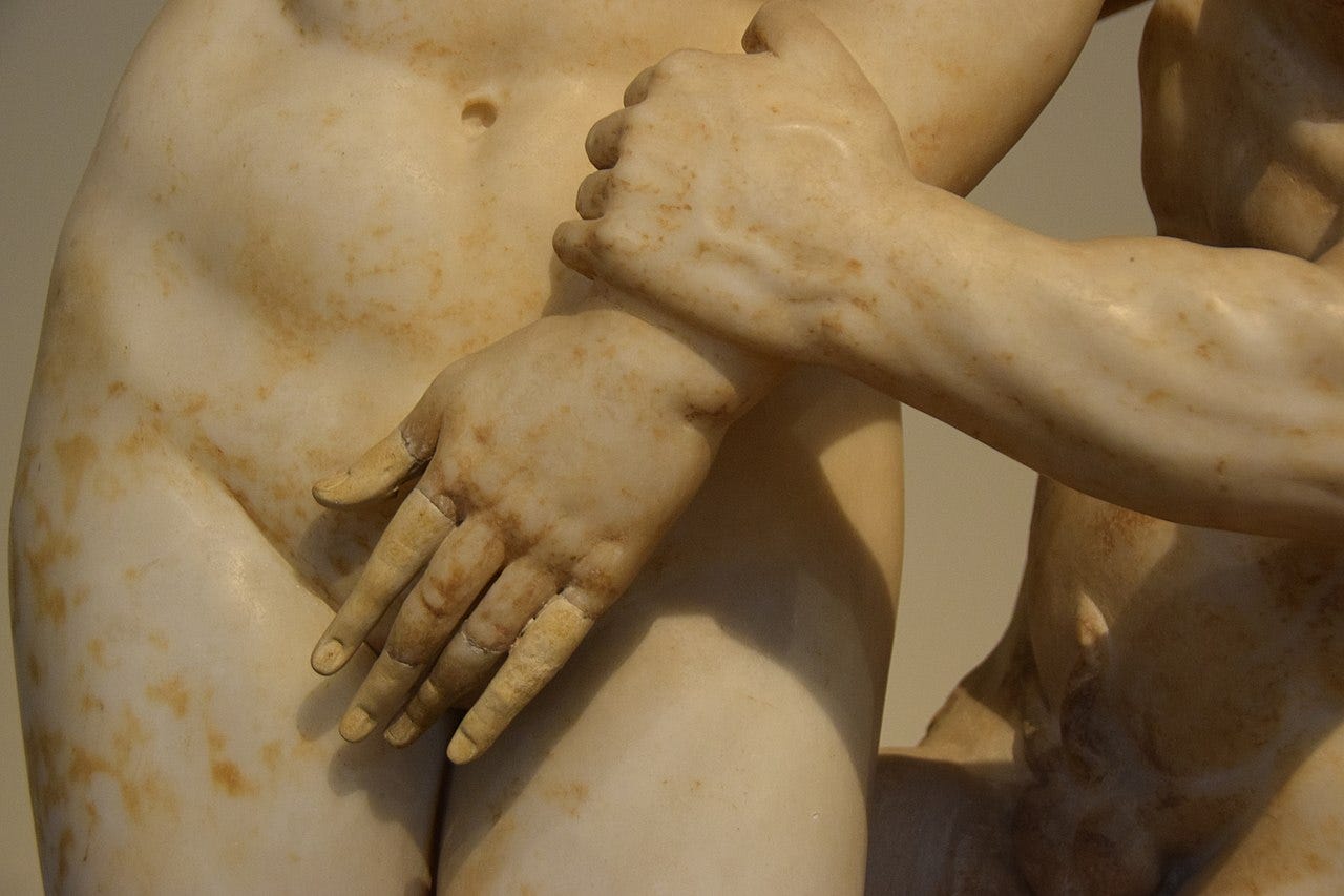 Aphrodite tries to cover herself.