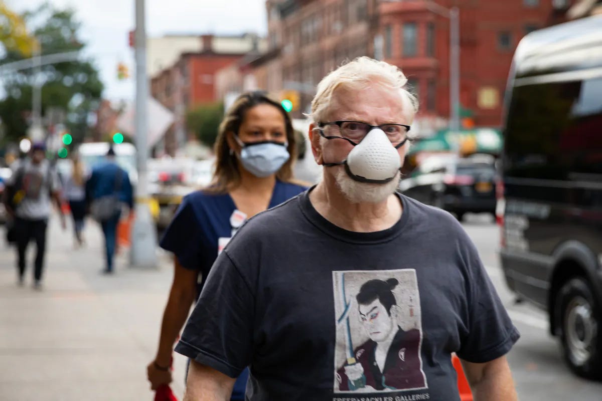 People wearing protective face masks walk on the street in Brooklyn, New York on October 7, 2020. (Chung I Ho/The Epoch Times)