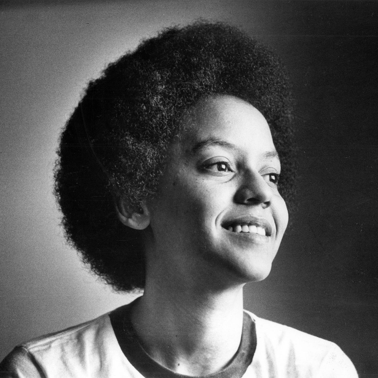 Image may contain Nikki Giovanni Face Head Person Photography Portrait Body Part Neck Happy Smile and Adult