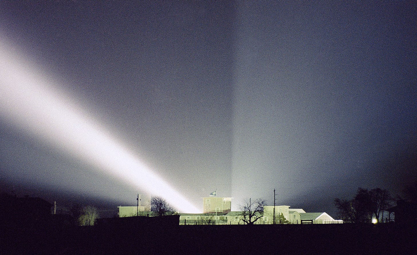 A spotlight shines over the Branch Davidian compound near Waco, Texas on March 22, 1993. (Rick Bowmer—AP)