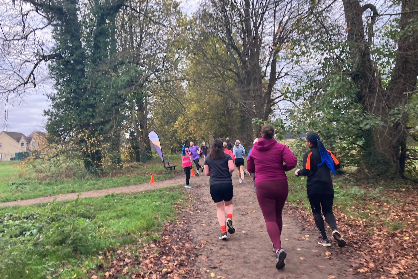 A group of runners approaching an intersection