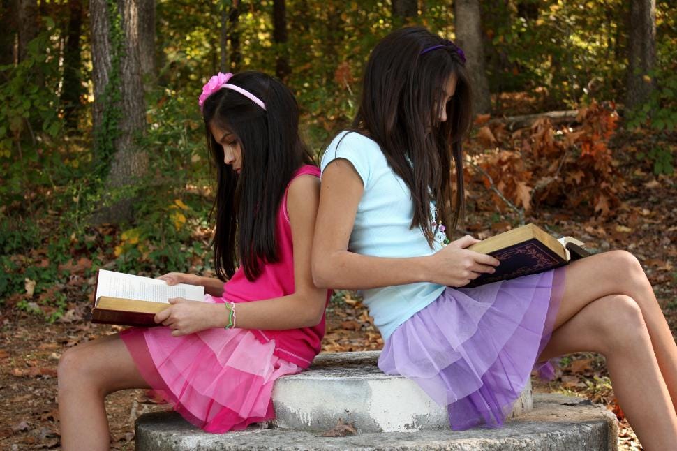 Free Stock Photo of Two cute young girls reading books outdoors | Download  Free Images and Free Illustrations
