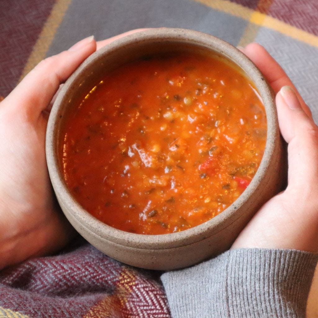 hands holding a rustic bowl of soup. Hygge for the soul: 5 ways to nourish an anxious mind from bramble and fox uk hygge shop