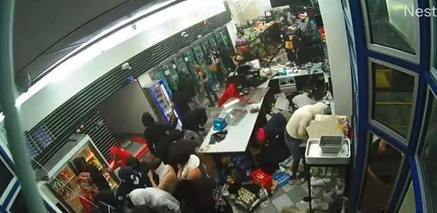 A smash-and-grab robbery was seen at this gas station convenience store in Oakland, California. Some 100 people came in and picked the shelves clean, and police never showed up