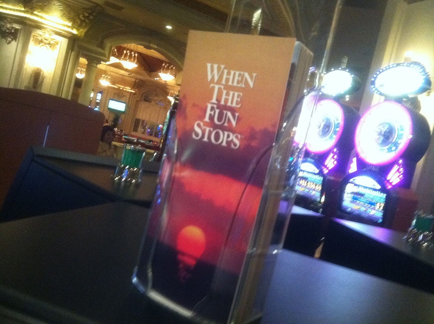 A picture I took at a casino in Vegas of a container of brochures entitled WHEN THE FUN STOPS on a table. Seriously it looks like a funeral parlor brochure