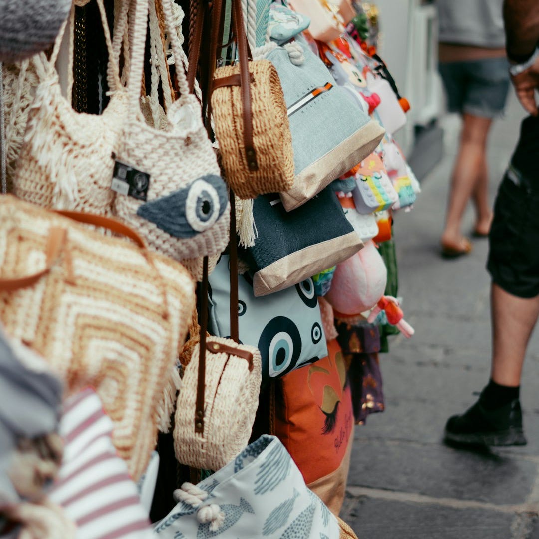 a bunch of purses that are on display