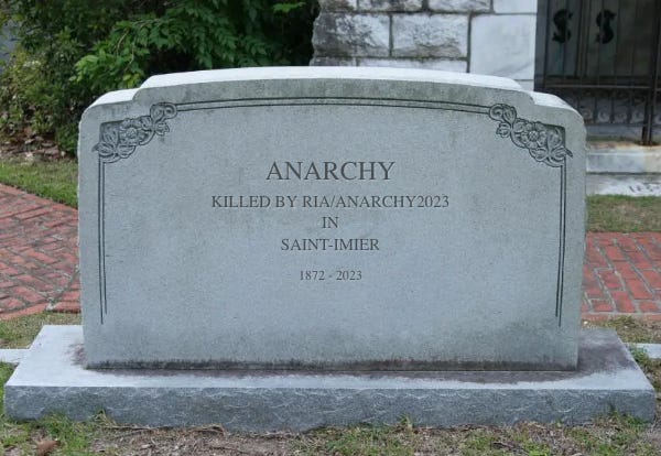 Tombstone reads: Anarchy. Killed by RIA/Anarchy2023. In. Saint-Imier. 1872 - 2023