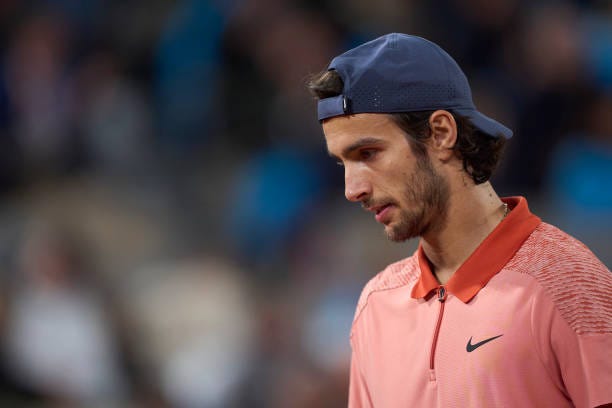 Lorenzo Musetti of Italy looks on during his match during his match against Novak Djokovic of Serbia in the Men's Singles third round match on Day...