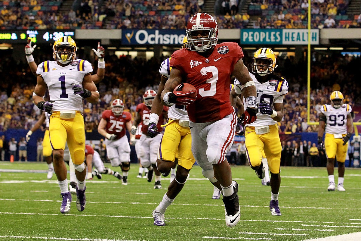 Alabama running back Trent Richardson chased by the LSU defense as he runs to the endzone in the January 2012 BCS national championship game