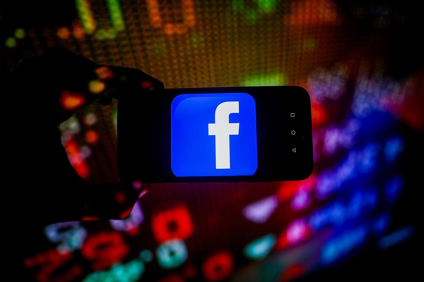  In this photo illustration, a Facebook logo is displayed on a smartphone with stock market percentages in the background. (Photo Illustration by Omar Marques/SOPA Images/LightRocket via Getty Images)
