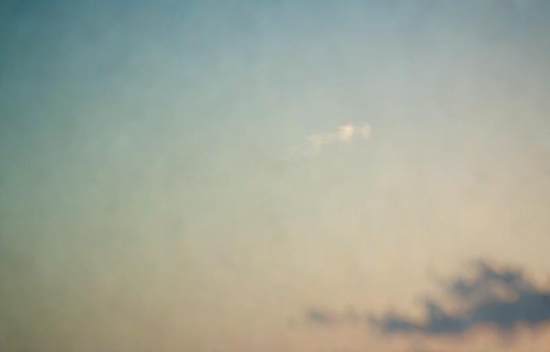 AI prompt "faint thin wisp of cloud in sky far away"