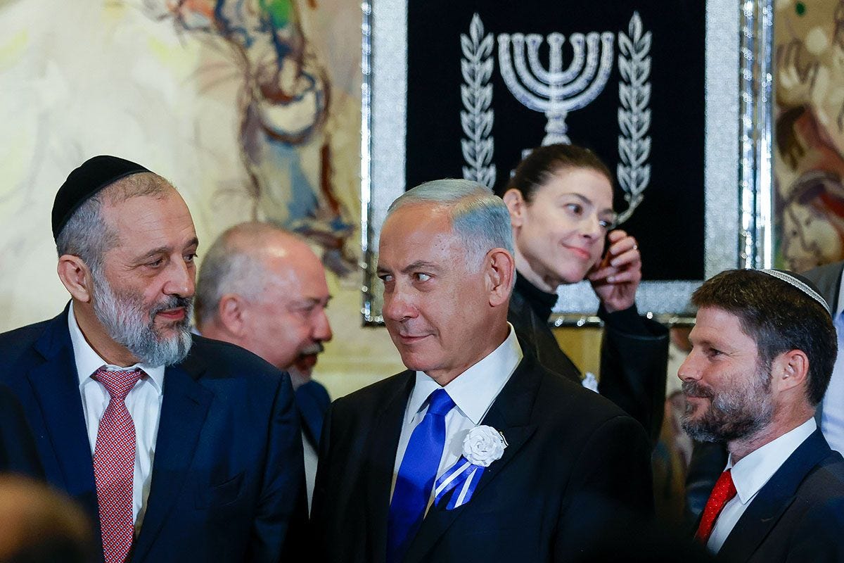 Likud leader MK Benjamin Netanyahu with Shas leader MK Aryeh Deri and Religious Zionism party head MK Bezalel Smotrich at a swearing-in ceremony of the 25th Knesset, at the Israeli parliament in Jerusalem, November 15, 2022. (Photo by Olivier Fitoussi/Flash90)