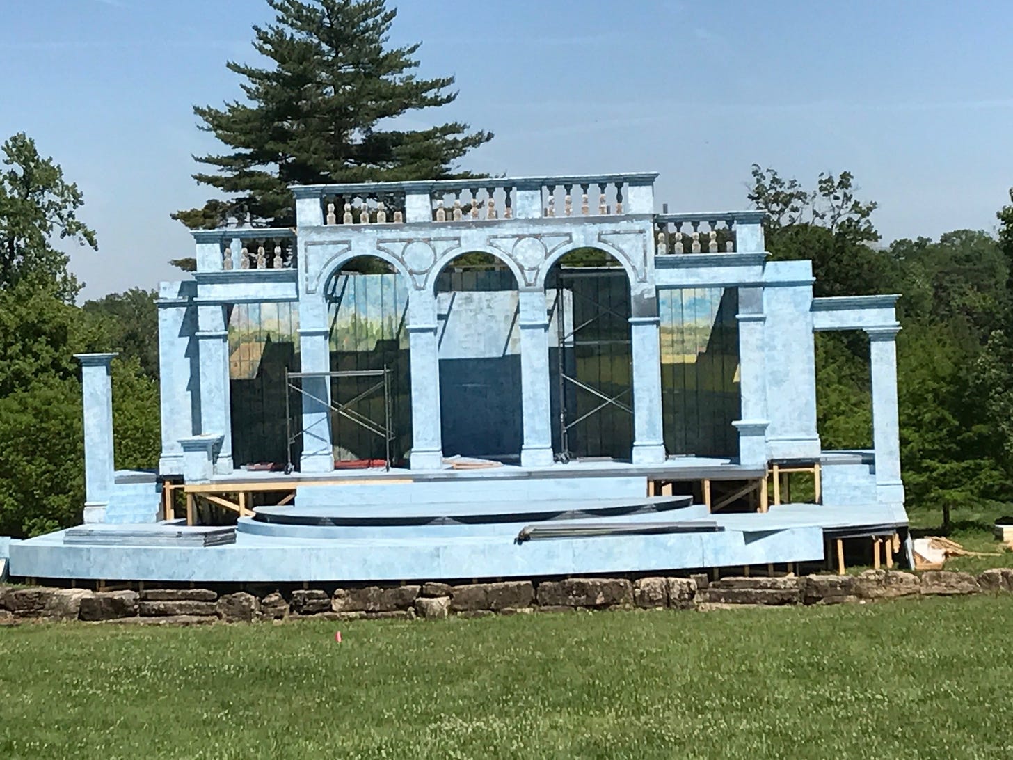 Stage being constructed in park setting