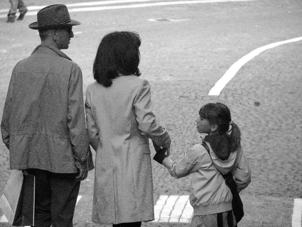 A person and person holding hands with a child

AI-generated content may be incorrect.