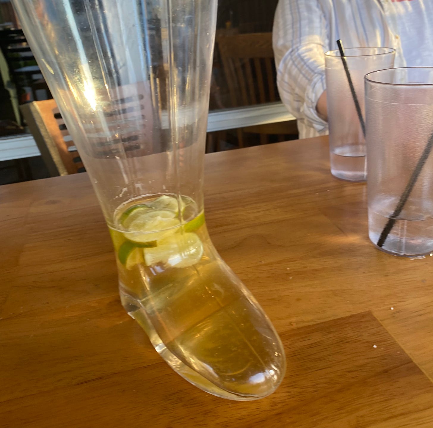 A beer boot, but just the shoe part is full and there's like twelve limes.