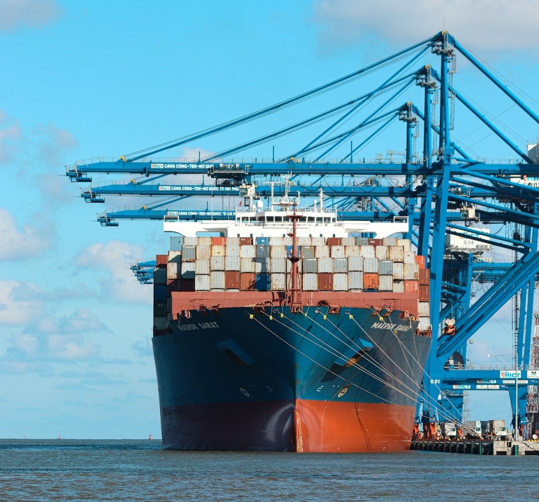 a large cargo ship at a dock