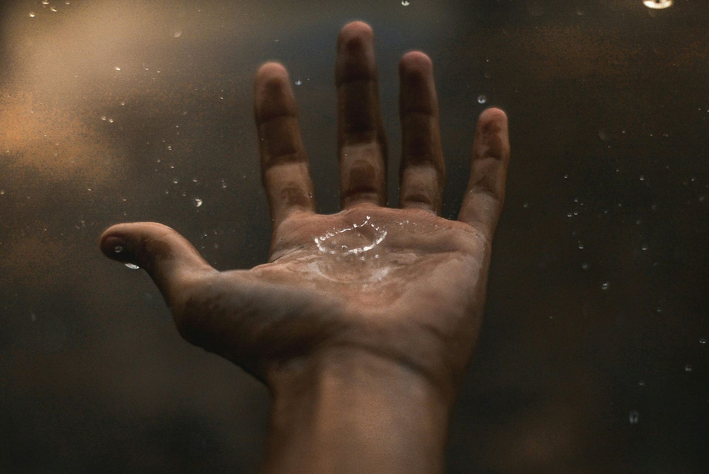 Photo of water droplet in dirty hand by Fabiano  Rodrigues via Pexels