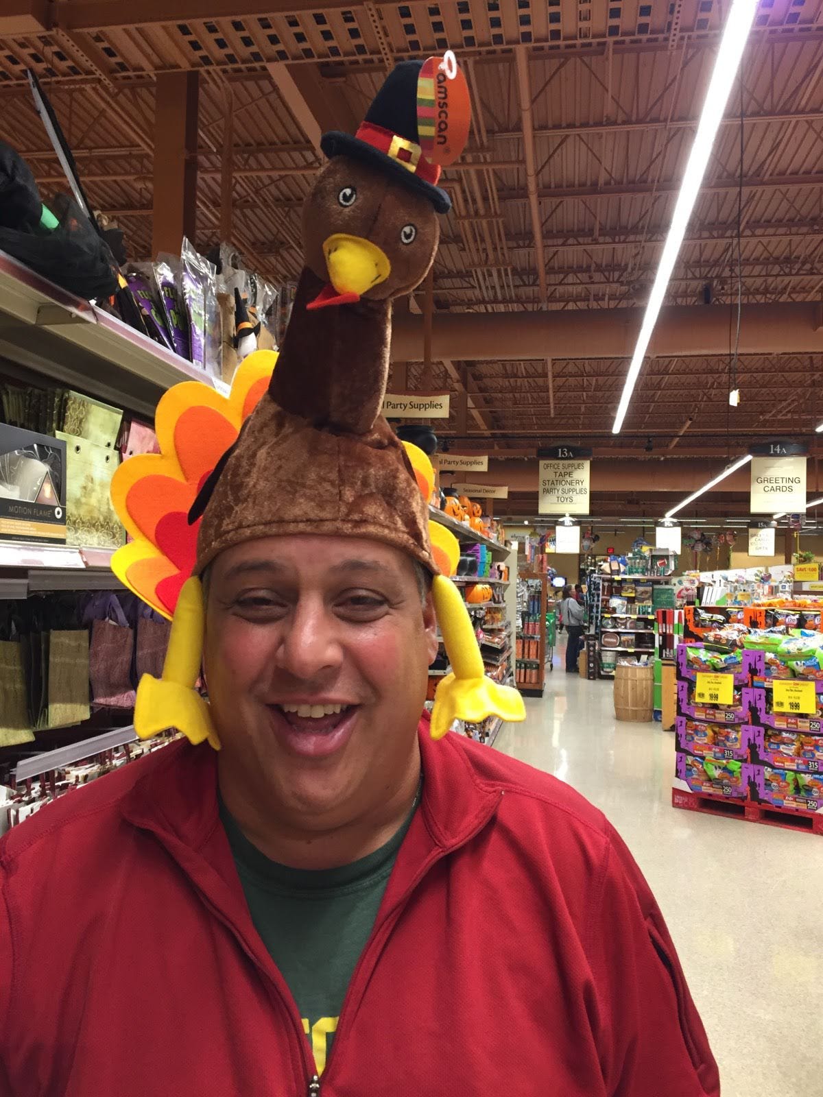My dad wearing a turkey hat in Wegmans